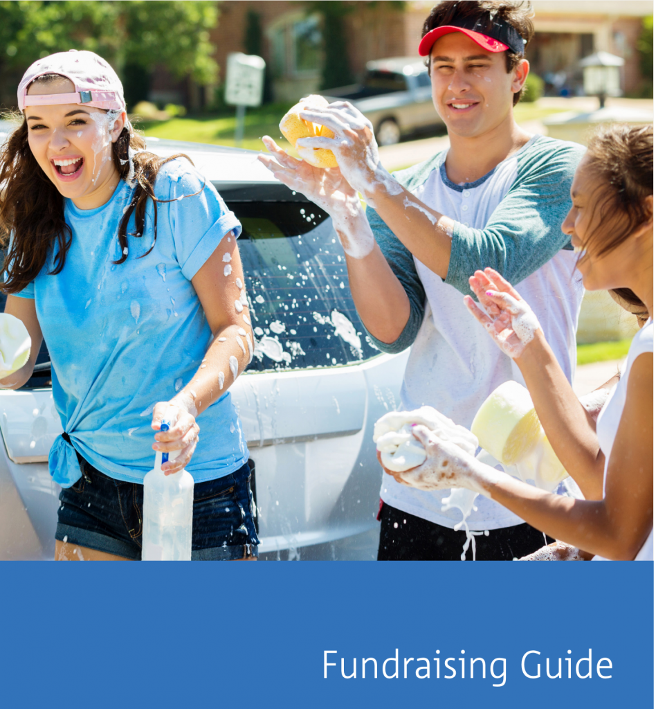 three students washing a car for fundraising